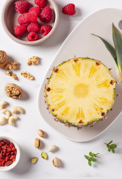 Steamed pineapple salad with raspberry mash and mint ingredients
